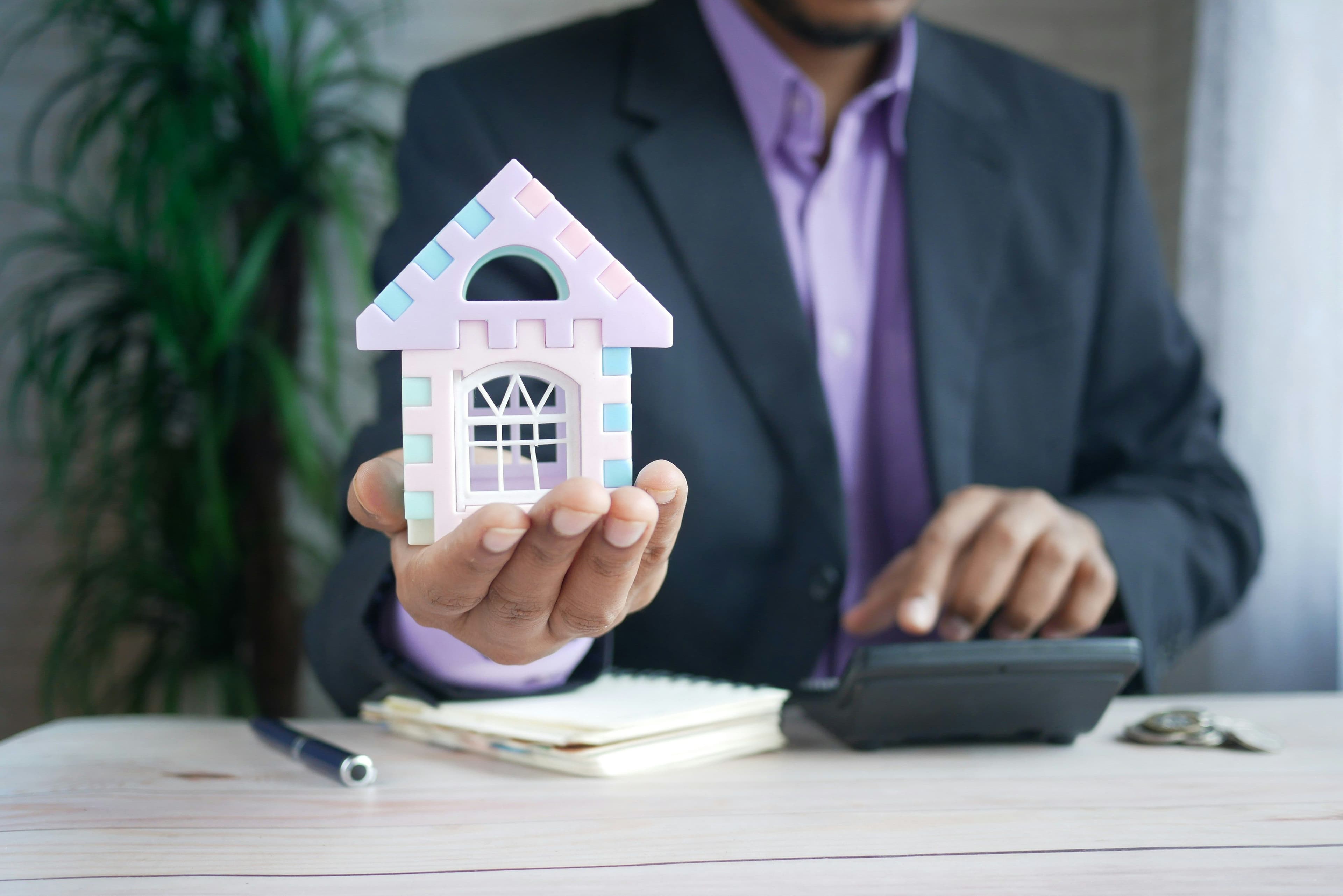 Agent holding a home